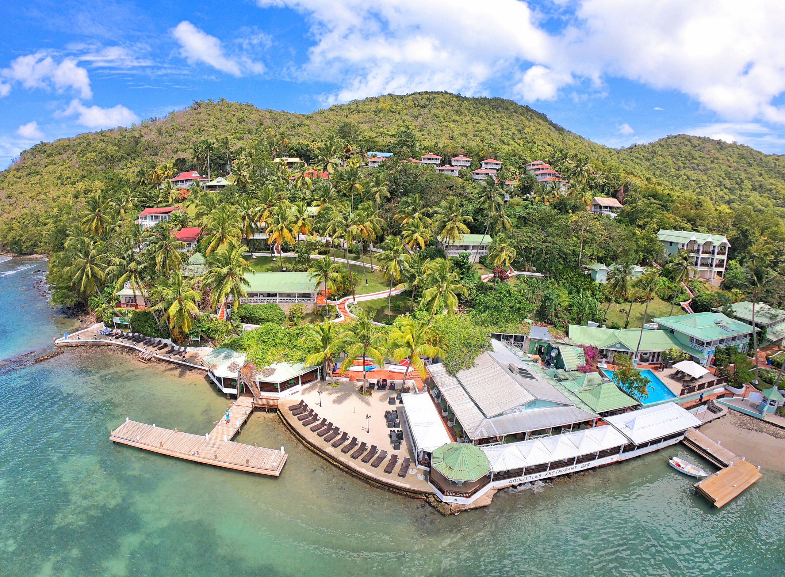 Genuine aerial view of Marigot Beach Club and Dive Resort on the waterfront in Saint Lucia